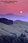 Full moon rising over Mount Diablo and rolling green hills in spring, near Orinda, Contra Costa County, California