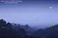 Full moon setting at dawn into fog from the Berkeley Hills, Alameda County, California