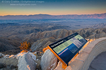 Interpretive sign at tourist overlook at sunrise, above the Coachella Valley, from Keys View, Joshua Tree National Park, California