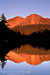 Alpenglow on Chaos Crags at sunset reflected in Reflection Lake, Lassen Volcanic National Park, California