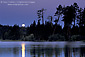 Moonset in pre-dawn light over Manzanita Lake, Lassen Volcanic National Park, California