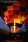 Flame fills Hot Air Balloon in pre-dawn light prior to tourist flight, Yountville, Napa Valley, California