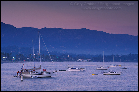 Photo:  Boats anchored offshore below distant coastal mountains, Santa Barbara, Southern Coast, California 