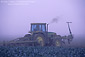 Farm plow tractor in fog shrouded field, near Guadalupe, Santa Maria Valley, San Luis Obispo County, CALIFORNIA