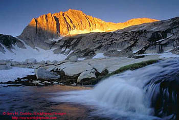 Cascade below a wedge of morning sun on North Peak, Nine Lakes Basin, Eastern Sierra, California