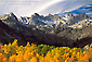 Aspen trees in fall colors below the high granite peaks of the Eastern Sierra, near Bishop, California