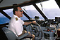 Picture: Captain piloting the Catalina Express Ferry toward  Avalon Harbor, Catalina Island, California