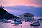 Picture: Red clouds at sunset over the Casino Building and boats in Avalon Harbor, Avalon, Catalina Island, California