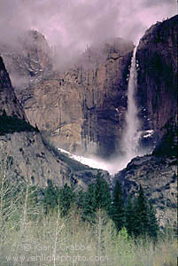 Yosemite Falls shrouded by storm clouds in spring, Yosemite Valley, Yosemite National Park, California