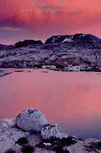 Red clouds at sunset over mountain lake, Hoover Wilderness, near Yosemite National Park, California