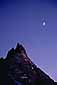 Crescent moon in evening light over Ragged Peak mountain, Yosemite National Park, California