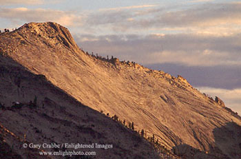 Sunset light on granite slope of Clouds Rest, above Tenaya Canyon, Yosemite National Park, California