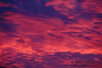 Alpenglow at sunset on altostratus storm clouds, over San Francisco Bay Area