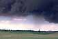 Squall line and developing microburst beneath dark grey cumulonimbus rainstorm cloud, California