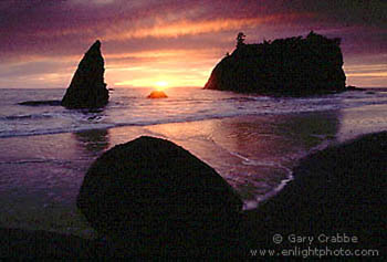 Sunset through storm clouds over sea stacks, Ruby Beach, Olympic National Park, Washington