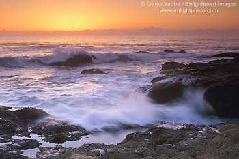 Waves breaking on coastal rocks at sunset, Point Lobos State Reserve, Monterey County, California