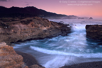Evening light and breaking waves at a small coastal cove, Point Lobos State Reserve, Monterey County, California