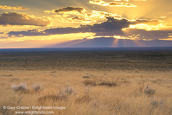 Sunbeams through storm clouds at sunset over the high plains of southern Colorado