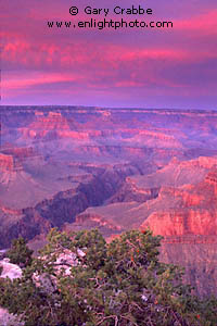 Alpenglow on clouds at sunset over the Grand Canyon, Arizona