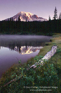 Mount Rainier (volcano) reflected in alpine lake at sunrise, Mount Rainier National Park, Washington
