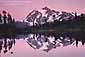 Evening light on Mount Shuksan reflected in an alpine lake in the Mount Baker National Recreation Area, Washington