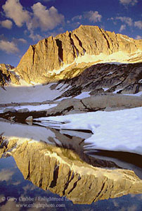 Sunrise light on North Peak mountain reflected in alpine lake, Nine Lakes Basin, Hoover Wilderness, near Yosemite National Park, California