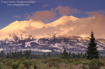 Alpenglow at sunset after a storm, Mount Shasta volcano, California