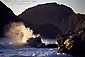 Wave crashing on rocks at sunset on the southern Oregon coast, near Gold Beach, Oregon