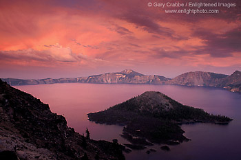 Alpenglow at sunset on storm clouds above Wizard Island and Crater Lake, Crater Lake National Park, Oregon