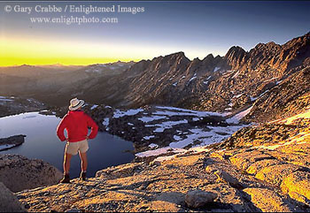 Hiker at sunset from 11,000 foot mountain pass, Hoover Wilderness, near Yosemite National Park, California