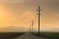 Picture: Sunset over long straight empty road in the Central Valley, Stanislaus County, California