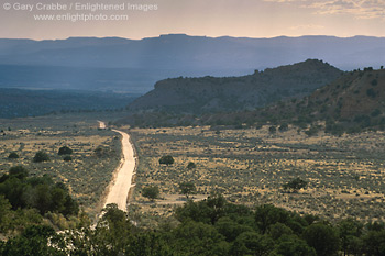 Photo: Long straight empty dirt road through high desert, Grand Staircase Escalante National Monument, Utah