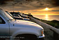 Picture: Golden sunset over the Pacific Ocean; Cars at the end of the road, Bodega Head, Sonoma Coast, California