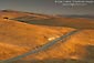 Picture: Country Road through golden hills at sunset, Altamont Pass, California