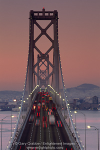 Photo: Commuter traffic on the San Francisco - Oakland Bay Bridge at dawn, San Francisco, California