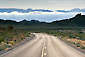 Photo: Two lane desert highway road belwo distand mountain peaks, Valley of Fire State Park, near Lake Mead, Nevada