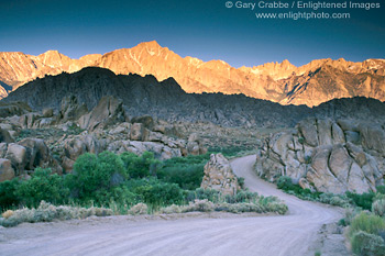 Image: Twisting dirt road below the High Sierra Mountain Peaks at sunrise, Alabama Hills, near Lone Pine, Eastern Sierra, California