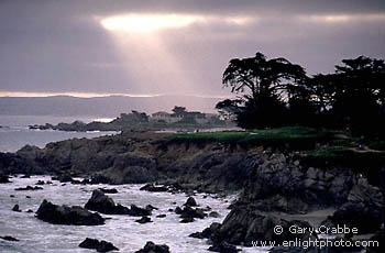 Sunbeams through coastal fog over Monterey, near Carmel, Monterey Peninsula, California