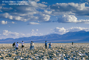 Tourists walking at the Devils Golf Course, Death Valley National Park, California