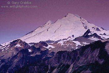 Pre-dawn light over snow covered glacier of Mount Baker volcano, Cascade Mountain Range, Washington