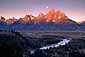 Alpenglow at sunrise as the full moon sets over the Teton Range and Snake River, Grand Teton National Park, Wyoming