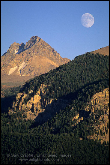 Moon rising over mountains, Grand Teton National Park, Wyoming