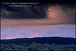 Picture of Glowing clkouds at sunrise below dark storm clouds ov sagebrush, Grand Teton National Park, Wyoming