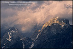 Picture: Sunlight on storm clouds near the summit of the Grand Tetons, Grand Teton Nat'l. Pk., WYOMING 