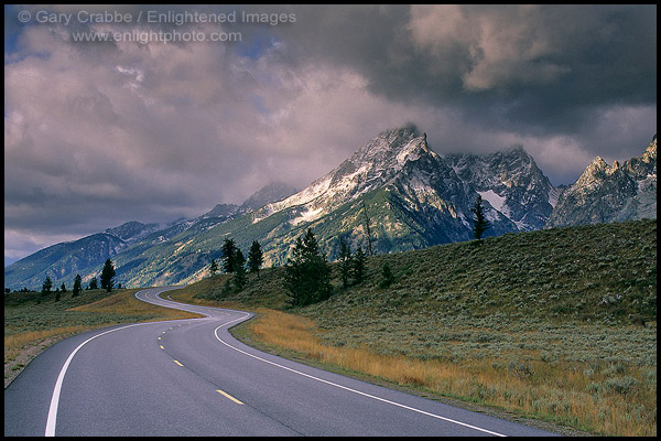 Photo: Curving road below mountain range dusted by first fall snow, Grand Teton National Park, Wyoming