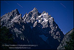 Star streaks at night over the Grand Tetons by light of full moon, Grand Teton Nat'l. Pk., WYOMING