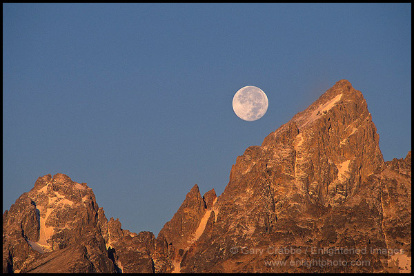 Photo: Full moon setting over the summit of the Grand Teton mountain at sunrise, Grand Teton National Park, Wyoming