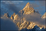 Picture: Sunrise light and clouds on the summit peak of the Grand Teton mountain, Grand Teton National Park, Wyoming 