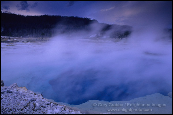 Photo: Steam rising off Sapphire Pool on a stormy evening, Biscuit Basin, Yellowstone National Park, Wyoming